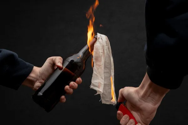 molotov-cocktail-ignited-lighter-on-600nw-2143449555
